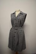 A late 1950s cotton gingham day dress, having embroidered flowers in pink, button down front and