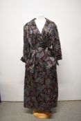 A late 1950s cotton sateen house coat having self covered buttons to front, pockets and belt to