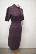 A 1950s burgundy and black checked day dress having faux neckerchief detail to reverse and faux