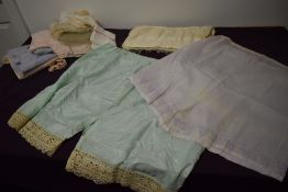 A selection of vintage and antique clothing, to include bloomers, handkerchiefs, aprons,