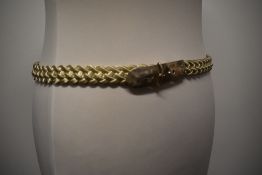 A vintage silver tone metal braided belt.