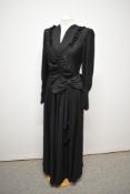 A dramatic floor length Art Deco 1930s evening gown, having gathered bodice with button details, bow