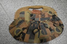 A circa 1930s patterned bag, having wooden handles, Af.