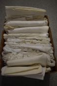 A box full of vintage and antique table linen, some intricate techniques used throughout the