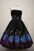 A 1950s strapless taffeta evening dress, having gathered cummerbund style waist, full skirt with