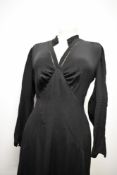 An Art deco 1930s day dress in black, simple, yet effective details thoughout, such as pin tucks,