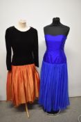 A 1980s Judy Mott strapless gown in electric blue silk and a Bernshaw dress of black velvet and