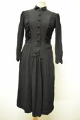 A 1940s textured crepe day dress, having full length sleeves, self covered buttons to front and