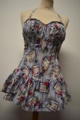 A crisp 1950s skirted halterneck floral cotton swimsuit, having shirred back and integrated