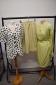 A 1980s black and white Yves Saint Laurent jacket and a mint green Valentino Boutique skirt and