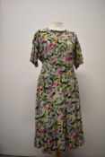 A beautiful late 1930s/ early 1940s colourful abstract floral patterned day dress having beautiful
