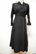 A 1940s textured crepe day dress, having panelling to under bust, novelty fabric button to front,
