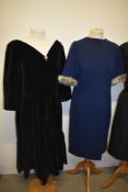 Three 1950s and 60s dresses, including black velvet dress with tiered skirt and side metal zip and