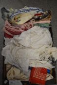 A miscellany of vintage items and accessories, including evening scarves, children's wear, apron and