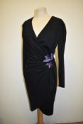 A Zandra Rhodes dress in black, having purple sequin detailing to waist.