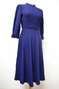 A navy blue wool 1940s day dress, having pin tuck to bust and sleeves, side zip and one to nape,