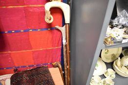 Four walking sticks including Shepherds crook with Ram form handle and similar horn handle