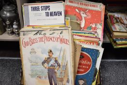 A large collection of antique and vintage piano sheet music.
