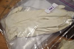 A vintage cotton Flour bag with print, a pair of cotton gloves and a silk scarf.