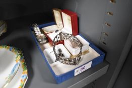 A small selection of silver and white metal jewellery including two pairs of stud earrings, a band