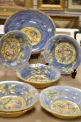 A set of vintage Vincit Veritas Majolica style hand decorated bowls including six small bowls and