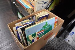 A collection of vintage PG tips cards and books.
