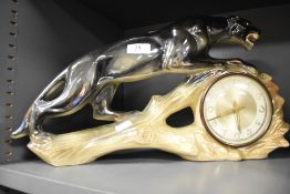 A 1930's Jema Holland ceramic mantel clock in the form of a Panther, in good condition.