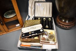 A selection of curios and trinkets including cocktail spoons, HM silver fruit knife, enamel pin