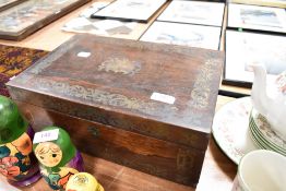 A Victorian writing slope having a rosewood case with inlaid brass detailing. Inside being partially