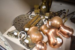 A selection of hardware including graduated copper ladles, large brass sieve and ashtrays.