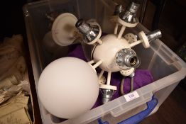 A vintage Atomic style light fixture in a sputnik design with glass shades.
