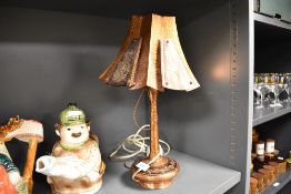 A mid century Spanish styled copper lamp and shade.