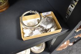 A selection of silver tone bangles and chains.