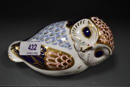 A Royal Crown Derby Gold stopper figure study of a reclining Owl,