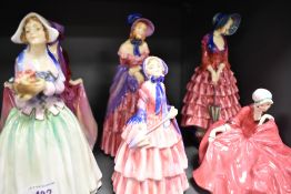 Six early 20th century Royal Doulton figurines all for restoration and having damage, Including
