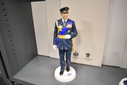 A limited edition Royal Doulton figure HRH Prince Charles HN5915 406/1000 with box and certificate.
