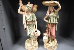 Two Royal Dux figure studies in bisque glazes of two water carriers both in excellent condition