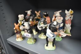 A complete set of twelve Beswick Pigs Promenade figure studies including two commissioned by