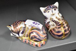 Two Royal Crown Derby Gold stopper paper weight figure studies of a Cat sleeping and a cat playing.