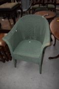 A vintage Lloyd Loom tub chair, in green