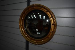 A vintage circular convex wall mirror having gilt frame, diameter approx. 51cm