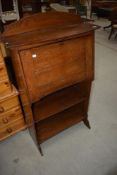 A late 19th or early 20th Century oak bureau having double shelf under, locks removed