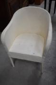 A vintage woven fibre style tub chair