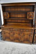 A reproduction oak dresser, probably Titchmarsh and Goodwin