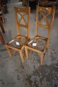 A pair of modern Oak Furniture land dining chair frames (no seats)