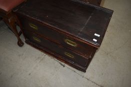 A 19th Century stained frame cupboard base, comprising two drawers with campaign style brass