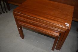 A mid century Gordon Russell walnut nest of three tables