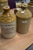 Two stoneware flagons, Salford and Bolton Interest
