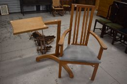 A bespoke golden oak carver chair and book stand, by Peter Hall & Son, Staveley