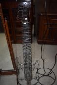 A metal CD rack modelled as electric guitar